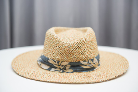 brown straw hat on white table, head-dressの写真素材