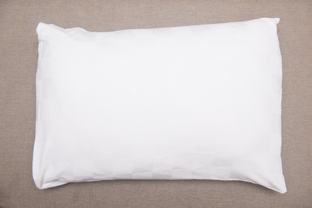 white pillow on sofa in bedroomの写真素材