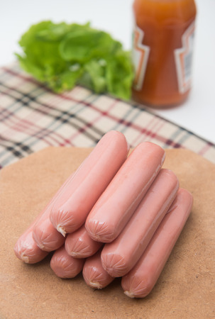hot dog sausages on wood pad, foodの写真素材