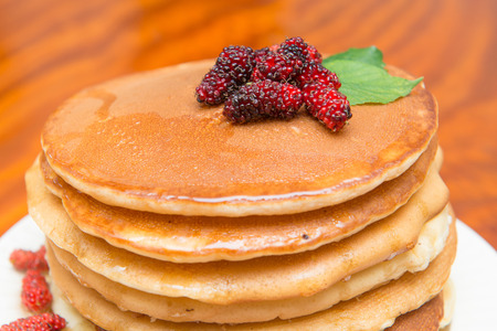 Delicious pancakes with fresh mulberry and honey, dessertの写真素材