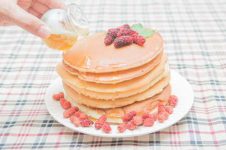 Delicious pancakes with fresh mulberry and honey, dessertの写真素材