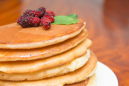 Delicious pancakes with fresh mulberry and honey, dessertの写真素材