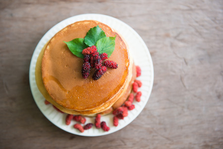 Delicious pancakes with fresh mulberry and honey, dessertの写真素材