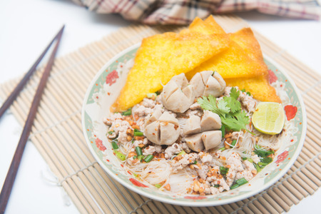 white noodles with meatballs and fried wonton, foodの写真素材