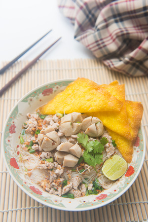 white noodles with meatballs and fried wonton, foodの写真素材
