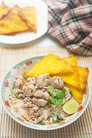 white noodles with meatballs and fried wonton, foodの写真素材