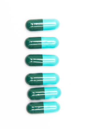 Tablets pills capsule on white background, drugの写真素材