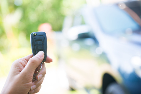 woman pressed on the remote to open the car, autoの写真素材