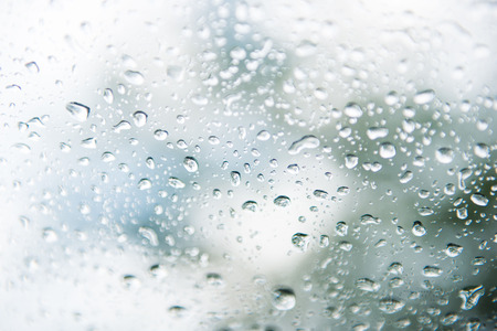 Drop of water from rain on glass, wetの写真素材