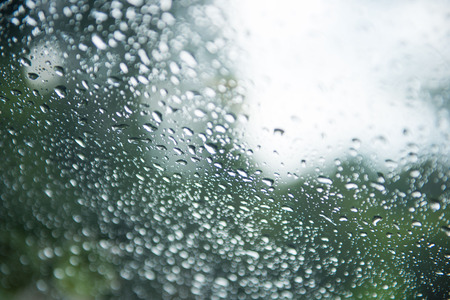 Drop of water from rain on glass, wetの写真素材