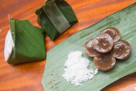 Thai dessert wrapped in banana leaves , cuisineの写真素材