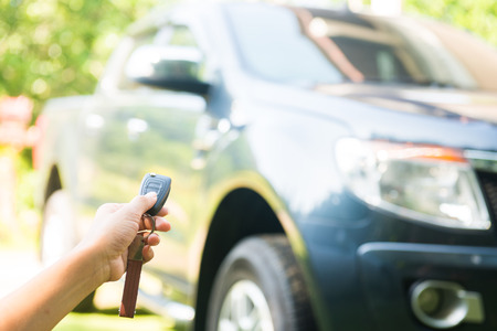 woman pressed on the remote to open the car, autoの写真素材