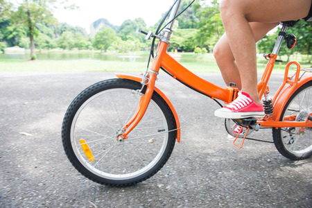 woman riding a bicycle in park, bikeの写真素材