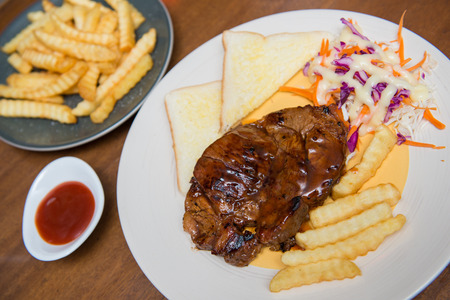 beefsteak with french fries and bread, cuisineの写真素材