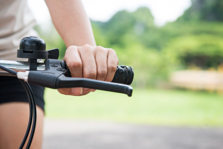 woman riding a bicycle in park, bikeの写真素材