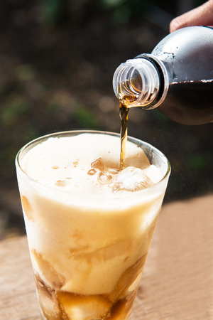 pouring sparking water into cup, drinkの写真素材