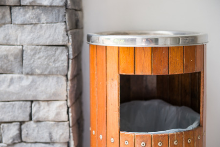 wood bins and ashtrays in front of toilet, trashcanの写真素材