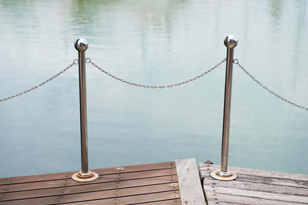 chain fence near the river, blockの写真素材