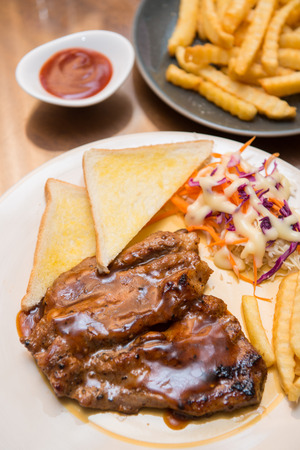 beefsteak with french fries and bread, cuisineの写真素材