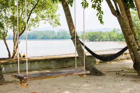 wooden swing and hammock for relaxation, beachの写真素材