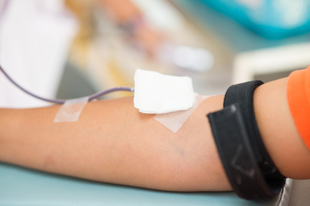 donating blood in a hospital room, healthの写真素材