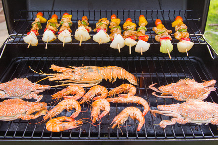 seafood and grilled barbecue chicken with colorful vegetable, foodの写真素材
