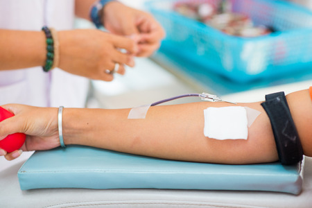 donating blood in a hospital room, healthの写真素材