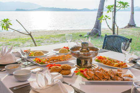 barbecue seafood for dinner by the sea, sunsetの写真素材