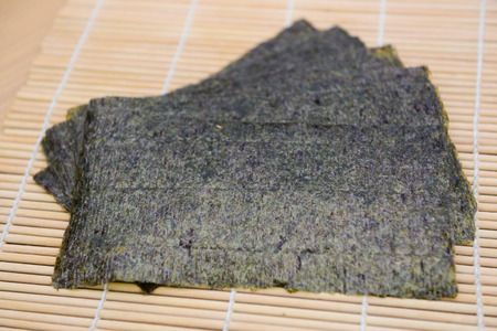 seaweed snack on bamboo mat, foodの写真素材