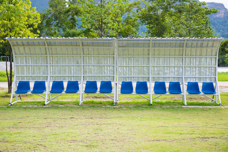 seats for coaches and athletes on the football field, outdoorの写真素材