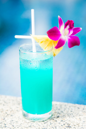 green cocktail with pineapple by the pool, drinkの写真素材