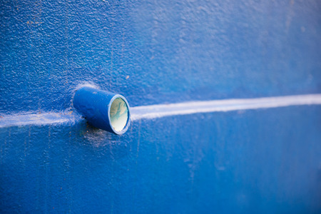 drain pipe on blue wall at home, sewerの写真素材