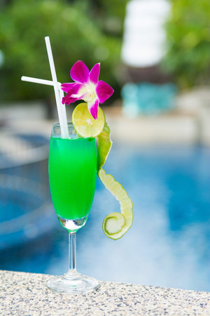green cocktail with lime by the pool, drinkの写真素材