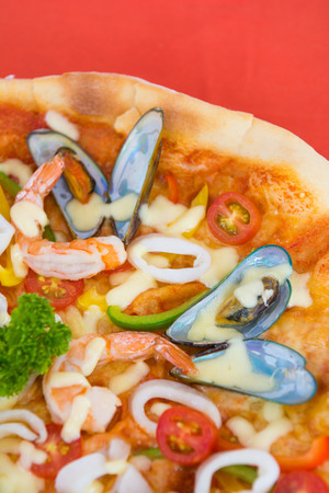 delicious hot seafood pizza from oven, foodの写真素材