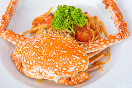 spaghetti with tomato sauce and steamed crabs, foodの写真素材