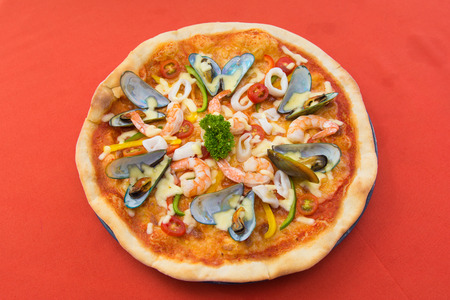 delicious hot seafood pizza from oven, foodの写真素材