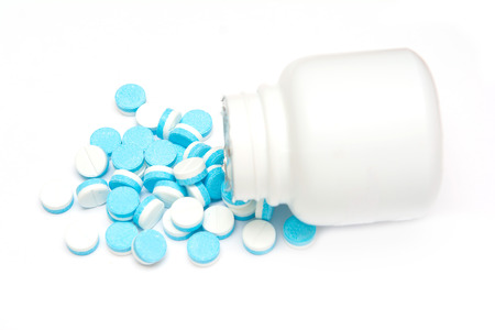 white and blue tablets pills from medicine bottles, drugsの写真素材