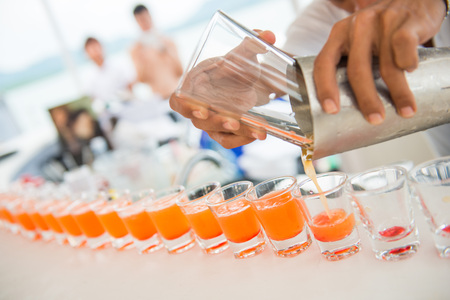 fresh orange juice in shot glasses, drink