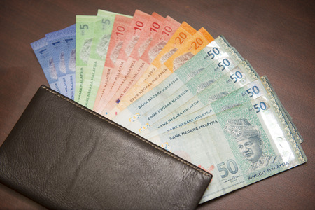 Malaysia money banknotes with brown wallet, ringgit