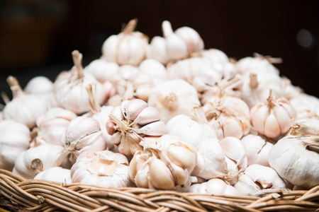 a lot of garlic in the basket, vegetableの写真素材