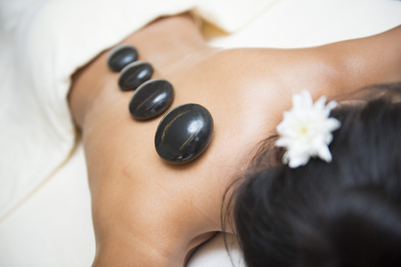massage with hot black stone by therapists, stone massage