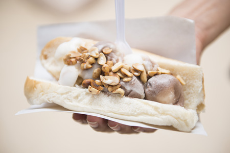ice cream with bread in hand hold, sweet