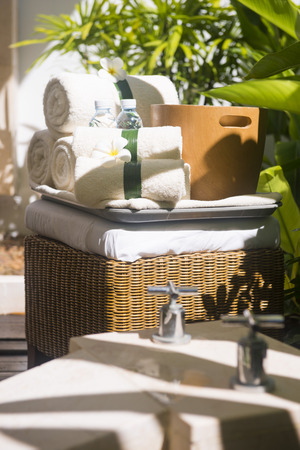 towels with white frangipani flowers in spa room, relaxのeditorial素材