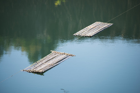 bamboo rafts floating in a lake, waterの写真素材