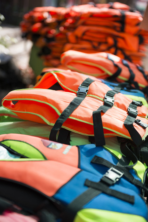 pile of many life jackets, safetyの写真素材