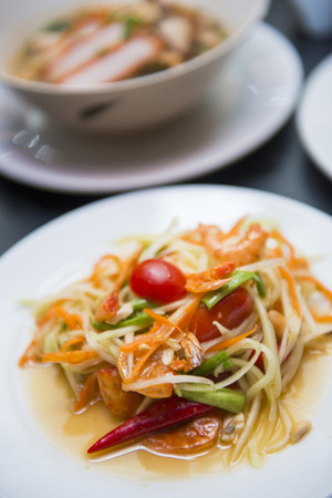 green papaya salad on dish, foodの写真素材