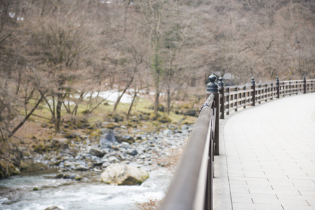 water of stream flows through between the stones, naturalの写真素材