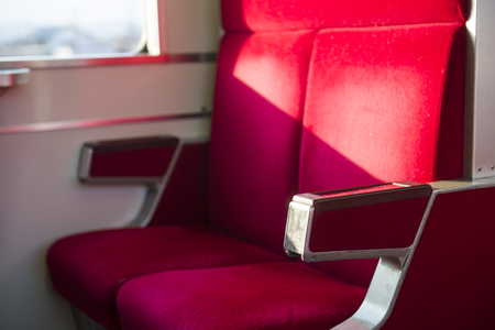 TOKYO, JAPAN - FEBRUARY 21, 2016 : red seats inside trains at Japan, Transportationのeditorial素材