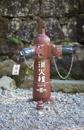NIKKO, JAPAN - FEBRUARY 22, 2016 : Japanese hydrant on the street in Nikko, Japan, equipmentのeditorial素材