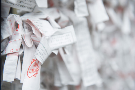 TOKYO, JAPAN - FEBRUARY 17, 2016 : Omikuji :: random fortune papers at Shinto shrines, Esiimsiのeditorial素材